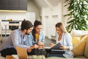 Couple working with insurance agent to understand their mobile home insurance policy